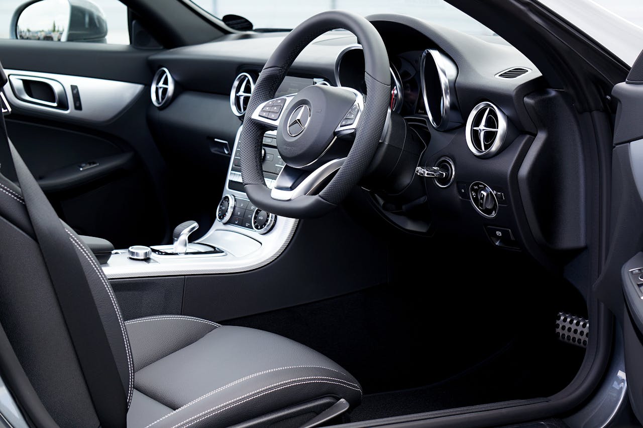 Explore the luxurious interior of a Mercedes SLC featuring sleek design and advanced controls.